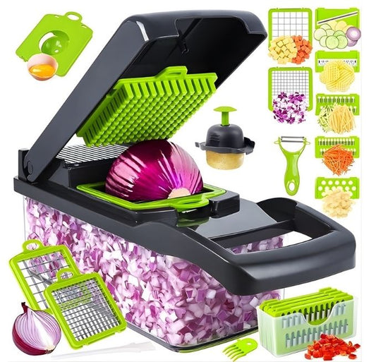 A multi-functional vegetable chopper and slicer set shown on a white background, featuring a large black and green container with an open lid, a red onion being processed, various green and black accessory blades, a peeler, a press, and a storage basket.
